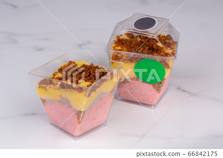 Fruit mousse of strawberries and mangoes, with the addition of mashed strawberries and mangoes Fruit mousse of strawberries and mangoes, with the addition of mashed strawberries and mangoes 66842175
