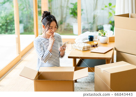 Young woman preparing to move 66843443