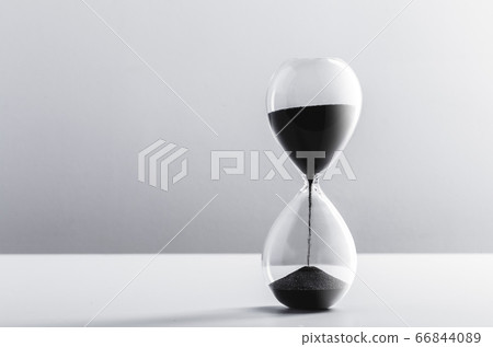 Close up hourglass on table 66844089