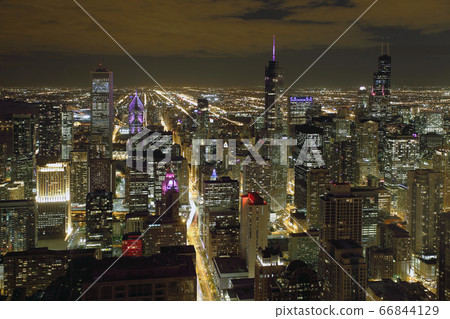 Atmospheric scene of Chicago at night showing Michigan Avenue and downtown Atmospheric scene of Chicago at night showing Michigan Avenue and downtown 66844129