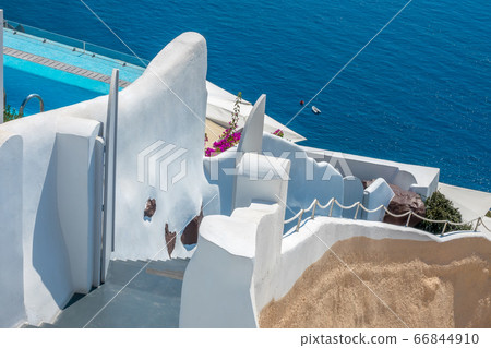 Traditional staircase to the sea between the white Traditional staircase to the sea between the white 66844910