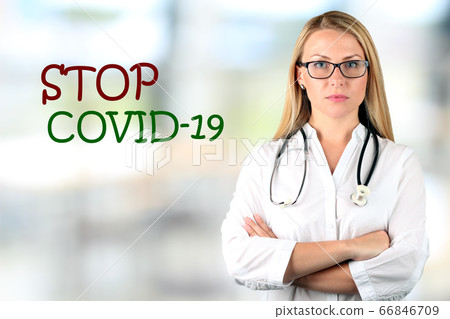 Image of a serious doctor looking at camera. STOP COVID 19 Image of a serious doctor looking at camera. STOP COVID 19 66846709