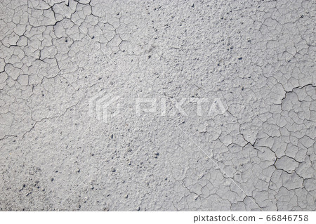 Dried cracked clay texture 66846758