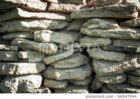 Beautiful pieces of concrete, stone wall close-up Beautiful pieces of concrete, stone wall close-up 66847044