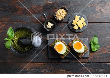 Fresh Green basil pesto eggs panini bread with pesto and hot sriracha sauce italian breakfast with ingredients green pesto top view Fresh Green basil pesto eggs panini bread with pesto and hot sriracha sauce italian breakfast with ingredients green pesto top view 66847311