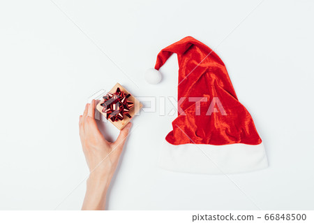 Woman's hand holding small gift box 66848500