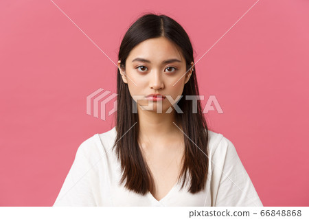 Beauty, people emotions and summer leisure concept. Close-up of gloomy and sad, tired young asian female employee looking at camera reluctant, standing distressed over pink background 66848868