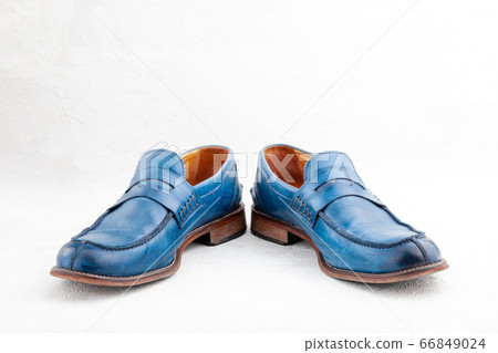 Pair of old leather blue discarded boots with laces Pair of old leather blue discarded boots with laces 66849024
