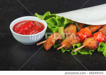 Baked barbecue pork with vegetables on lettuce Baked barbecue pork with vegetables on lettuce 66849543