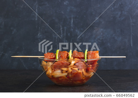 Pork marinated with onion and soy sauce on skewers Pork marinated with onion and soy sauce on skewers 66849562