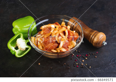 Pork marinated with onion, spices and Bell pepper Pork marinated with onion, spices and Bell pepper 66849571