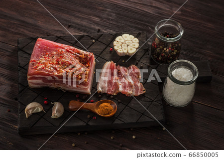 Salted dried bacon with spices and bay leaves and 66850005
