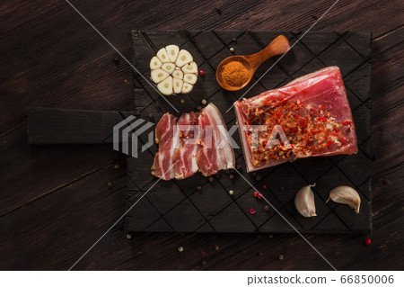 Salted dried bacon with spices and bay leaves and 66850006