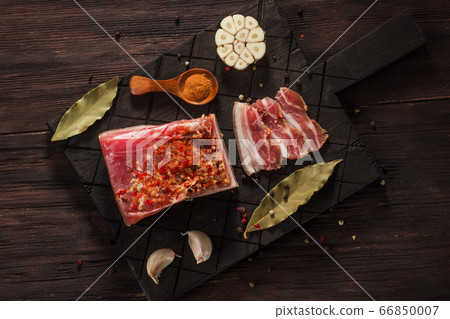 Salted dried bacon with spices and bay leaves and 66850007