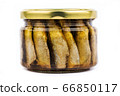 Glass jar of sprats on a white background isolate 66850117