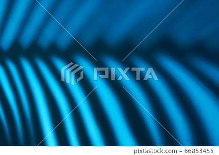 Beautiful monstera leaves shadow colored background in artificial light 66853455