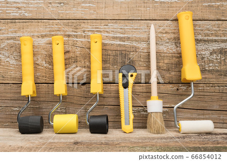 Manual painting tools on wooden background. A paint tool for Wallpaper. 66854012