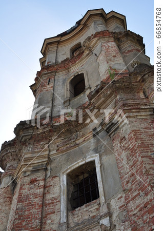 Old collapsing building. Brickwork. Empty windows. Old collapsing building. Brickwork. Empty windows. 66854768
