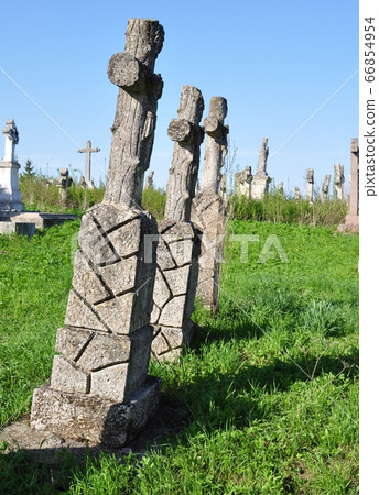 Monuments in an abandoned cemetery. Crosses. 66854954