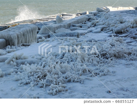 The icy shore of the Black Sea. Bizarre ice figures. The icy shore of the Black Sea. Bizarre ice figures. 66855127