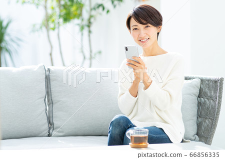 Middle female smartphone Middle female smartphone 66856335