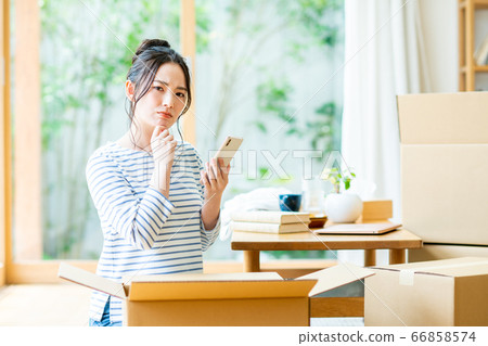 A young woman worried about moving 66858574