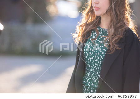A beautiful woman stands outside woman winter A beautiful woman stands outside woman winter 66858958