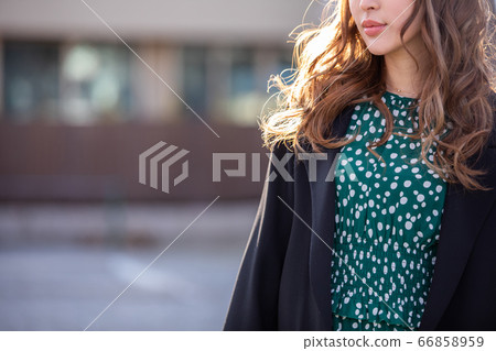 A beautiful woman stands outside woman winter A beautiful woman stands outside woman winter 66858959