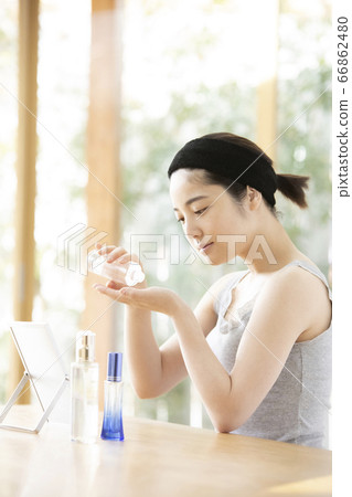 A young woman doing skin care A young woman doing skin care 66862480