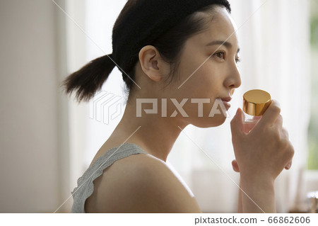 A young woman doing skin care A young woman doing skin care 66862606