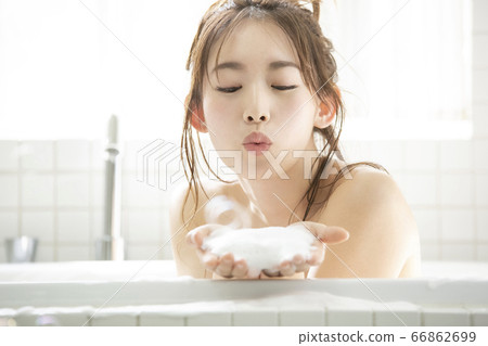A young lady bathing A young lady bathing 66862699
