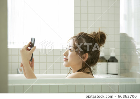 A young lady bathing A young lady bathing 66862700