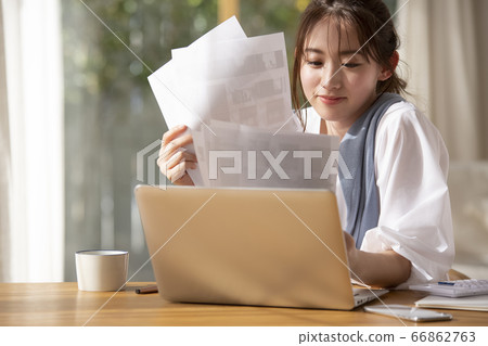 Woman doing work at home Woman doing work at home 66862763