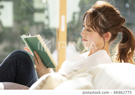 A young woman reading A young woman reading 66862775