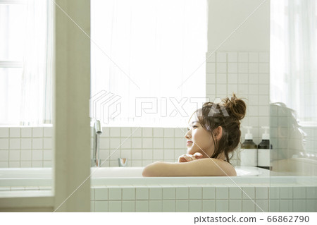 A young lady bathing A young lady bathing 66862790