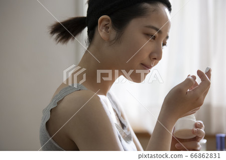 A young woman doing skin care A young woman doing skin care 66862831