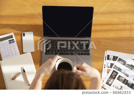 Woman doing work at home Woman doing work at home 66862833