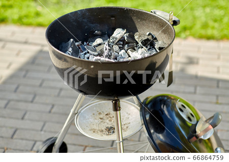charcoal smoldering in brazier outdoors 66864759
