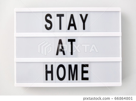 lightbox with stay at home caution words lightbox with stay at home caution words 66864801