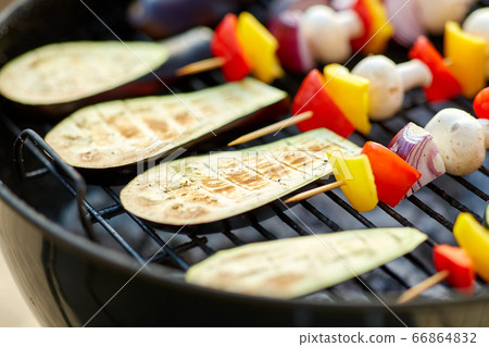 vegetables and mushrooms roasting on brazier grill vegetables and mushrooms roasting on brazier grill 66864832