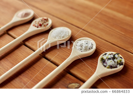 spoons with salt and spices on wooden table spoons with salt and spices on wooden table 66864833