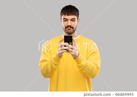 young man with smartphone young man with smartphone 66864945
