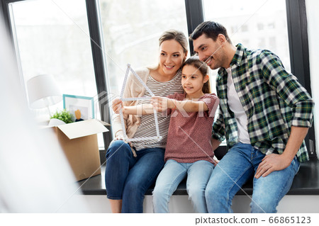 happy family with folding ruler moving to new home happy family with folding ruler moving to new home 66865123