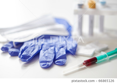 close up of blood in syringe, gloves and mask close up of blood in syringe, gloves and mask 66865126