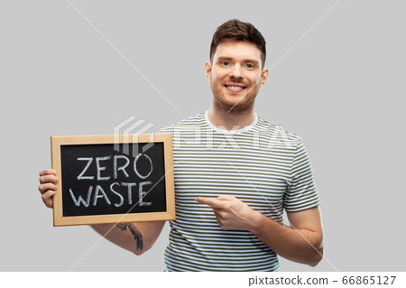 smiling man holding chalkboard with zero waste smiling man holding chalkboard with zero waste 66865127