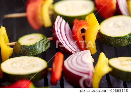 close up of vegetables roasting on brazier grill close up of vegetables roasting on brazier grill 66865128
