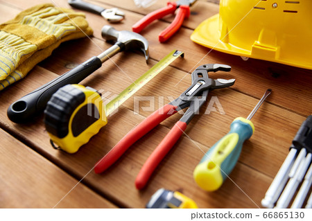 different work tools on wooden boards different work tools on wooden boards 66865130