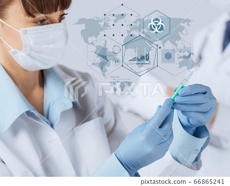 doctor in medical mask over world pandemic map 66865241