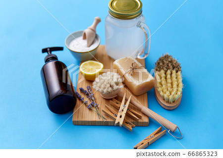 washing soda, soap, brushes, lemon and clothespins washing soda, soap, brushes, lemon and clothespins 66865323