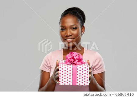 happy african american woman with birthday present happy african american woman with birthday present 66865410